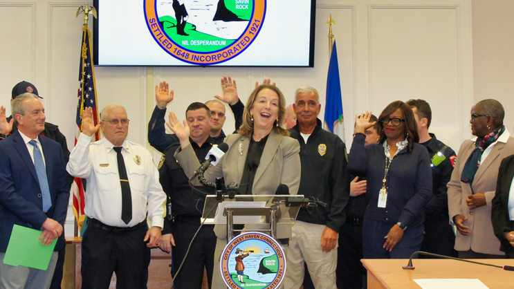 Jens Frederiksen and Dorinda Borer with first responders at the press conference announcing the expansion of the partnership.